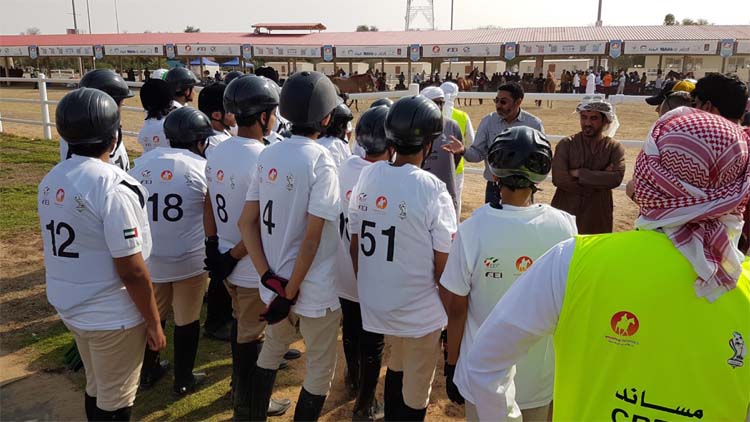 Briefing and instructions before the start of the special 10 km ride. Note that the less experimented children wear a body protector in case of a fall